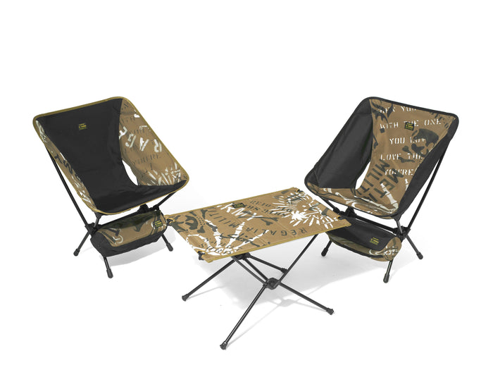 Helinox camp set with two chairs and a table in olive green stencil graphic print